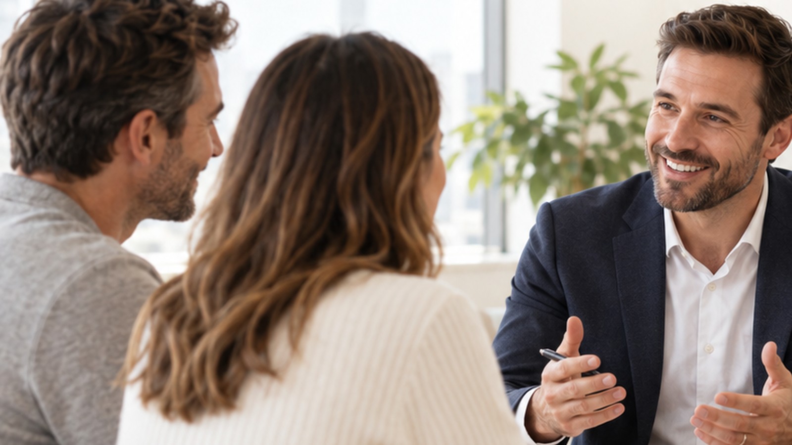 Couple speaking with a financial adviser